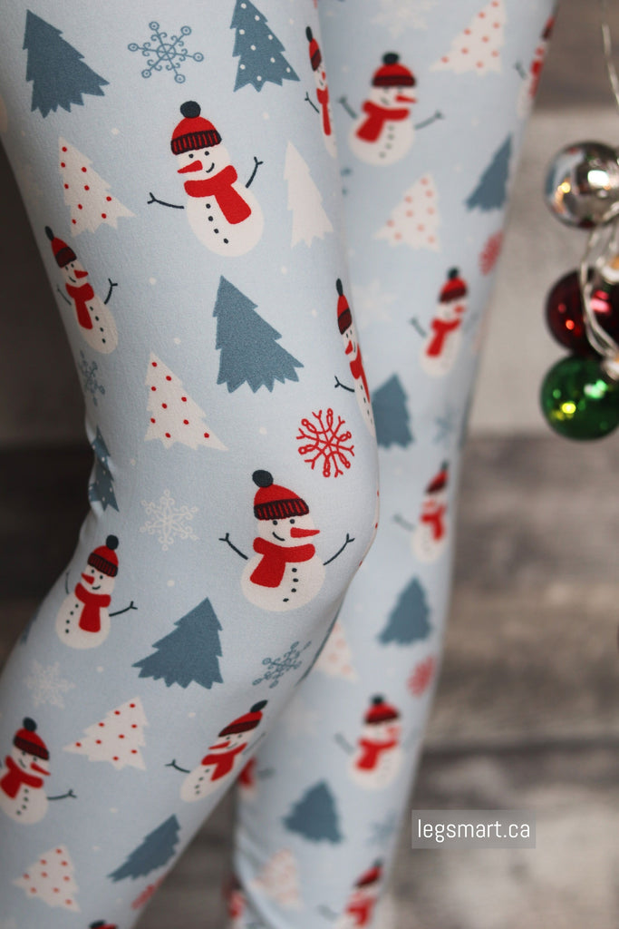 Light blue Christmas leggings with snowmen, trees and snowflakes