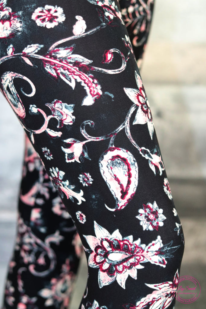 black leggings with a delicate pink floral pattern