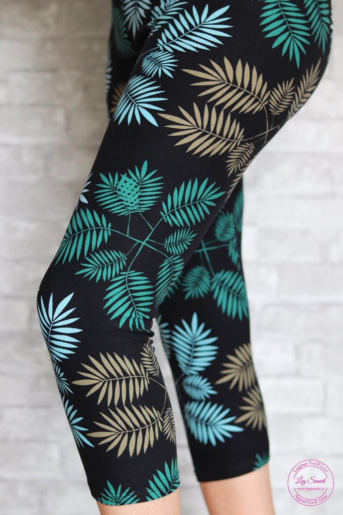 black capri leggings with a tropcial leaf print