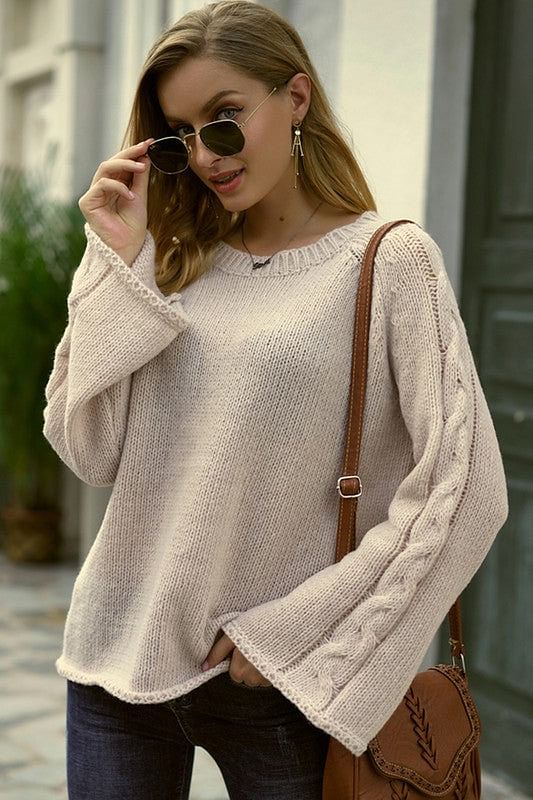 sweater with braiding detail down the sleeve