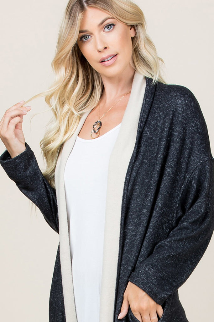 Buttery soft two tone hacci cardigan featuring cream colour contrast detailing and side pockets.