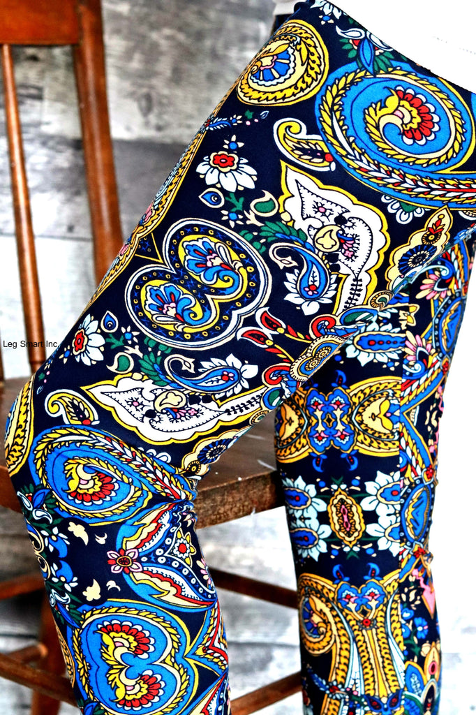navy leggings ornately decorated with hints of yellow, red and white,