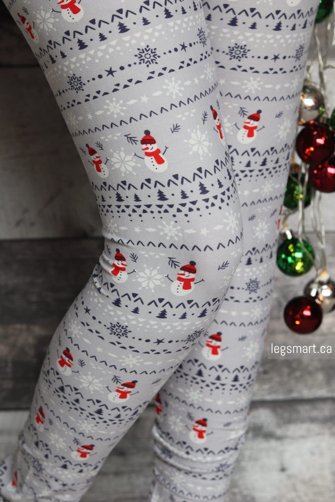 Grey Christmas leggings printed with festive white snowflakes and cute snowmen