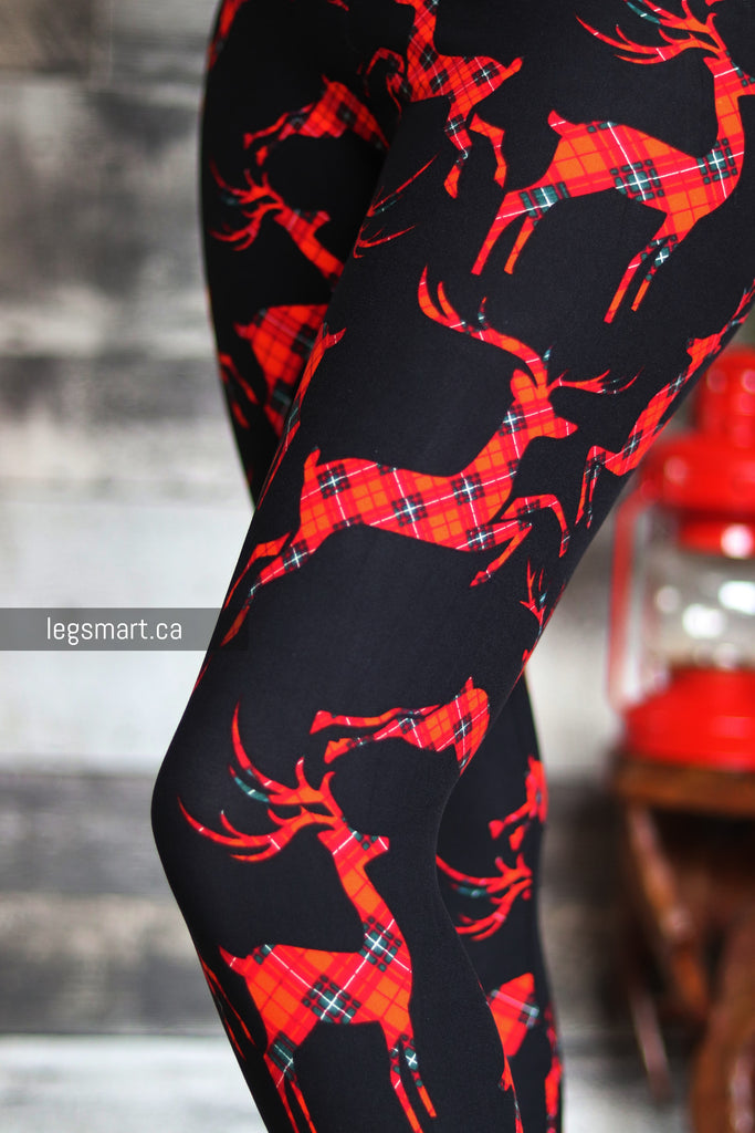 black girls leggings with a red plaid reindeer print 