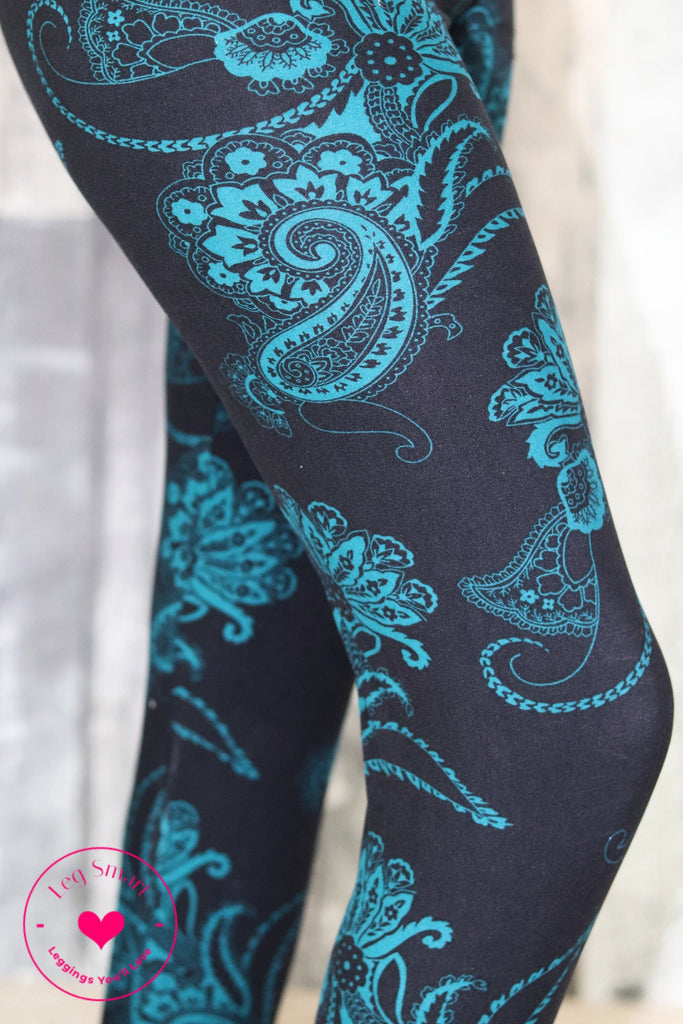 Buttery soft black yoga band leggings with a blue-green paisley print