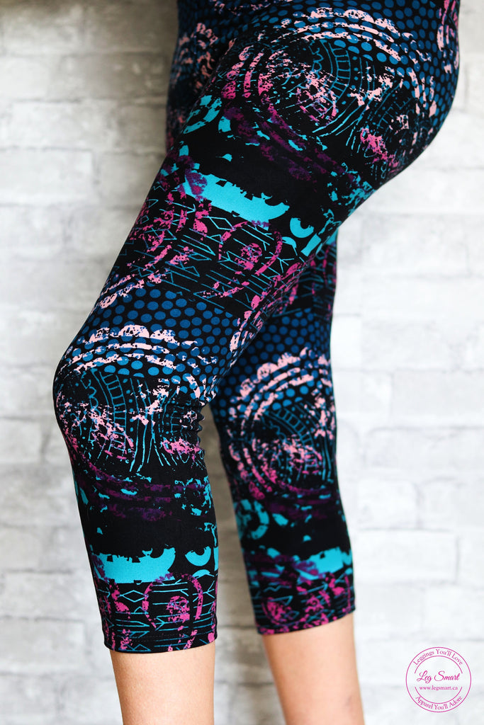 black capri leggings with pink, blue and teal a in mosaic pattern