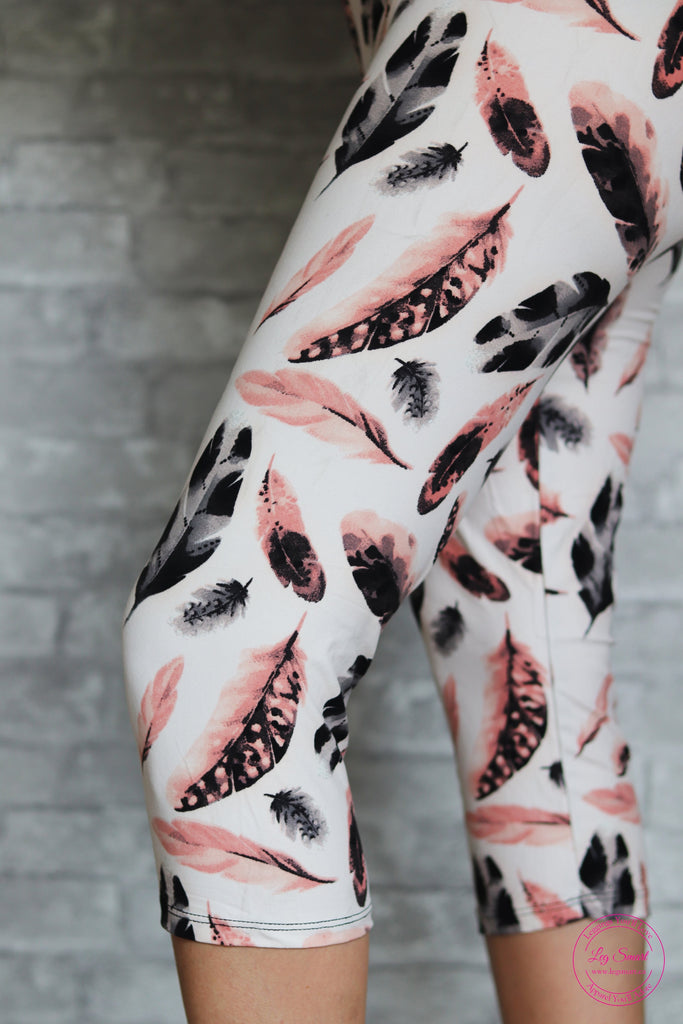 white capri leggings with a delicate feather pattern