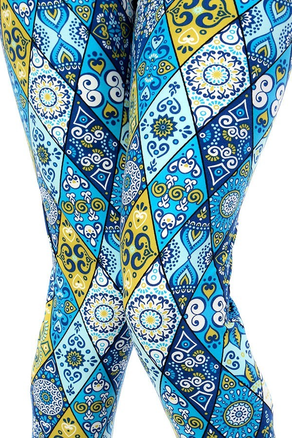 patchwork styled leggings with shades of blue, white, and yellow