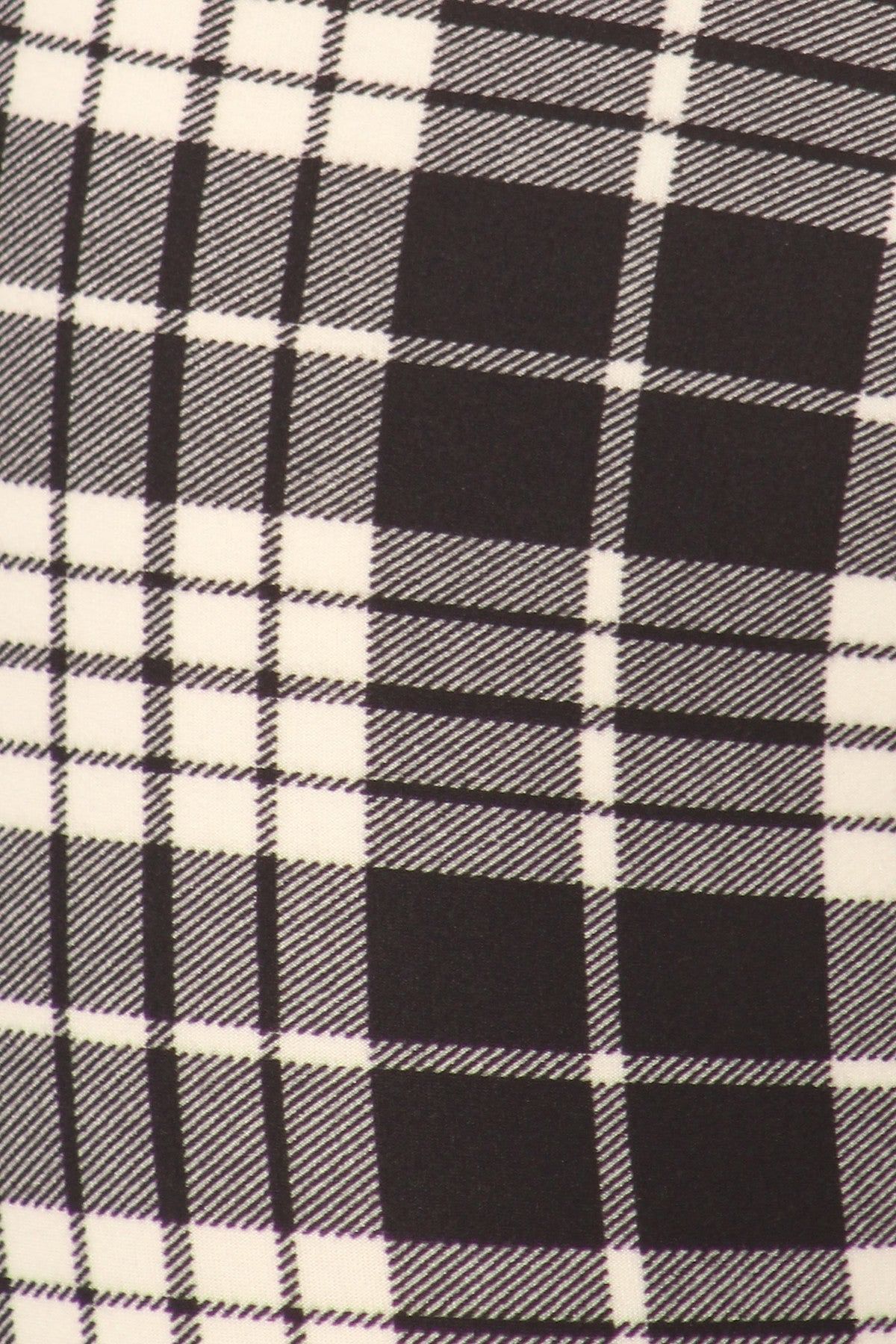 Black and white plaid leggings close up
