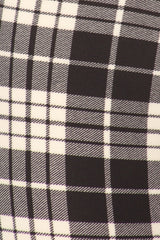 Black and white plaid leggings close up