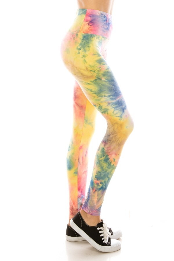 pink, blue and yellow tie dye leggings with a yogaband waist. The print looks like a morning sunrise or watercolour painting.