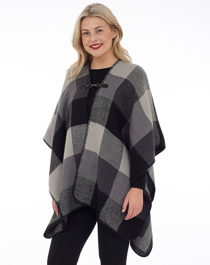 womens cape with a grey and black checkered design