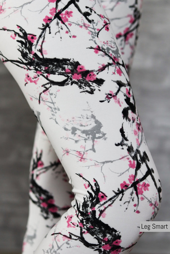 Girls white leggings with pink and black cherry blossom print