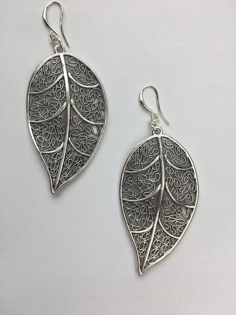 Handmade Silver earrings with an intricate leaf design